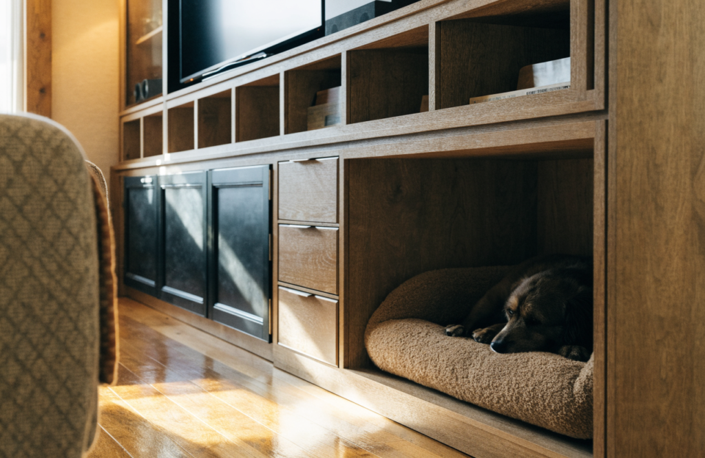 Dog in an open lower bay of a living room media wall