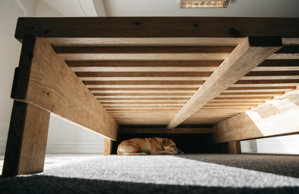 Platform bed center beam kept to one side to leave room for a dog bed