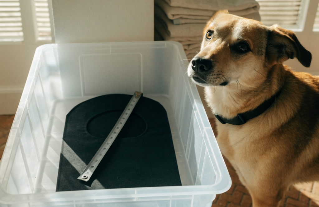 Dog bed mat cut to fit a crate tray, with a tape measure